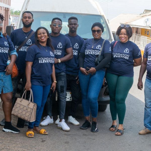 The Foundation Elevators volunteer team gathered beside the delivery van