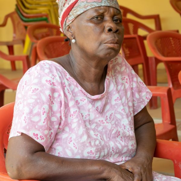 Portrait of a widow seated at the Widows in Need gathering