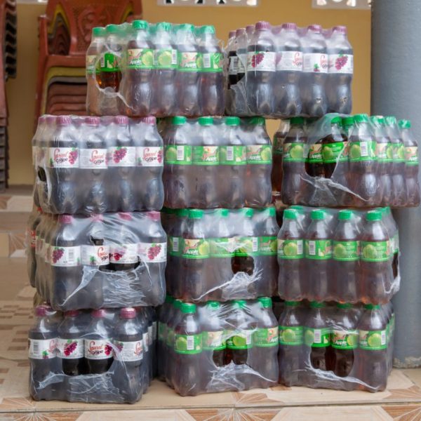 Crates of bottled drinks stacked ready for distribution
