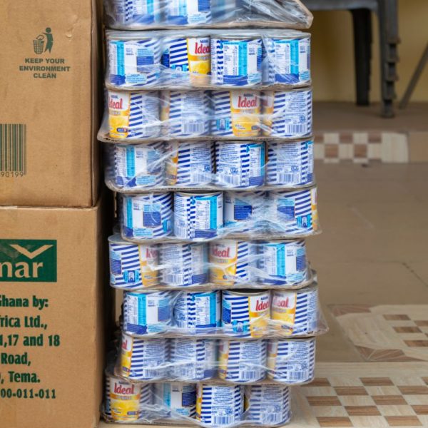 Cartons of tinned fish and cooking supplies awaiting distribution