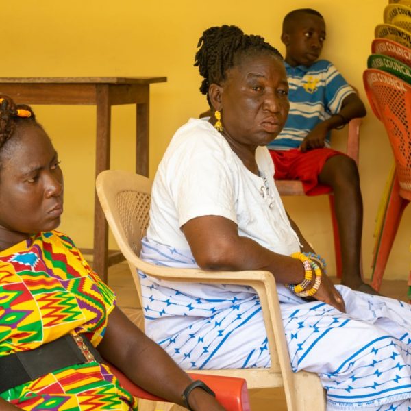 Two women in conversation at the Widows in Need gathering