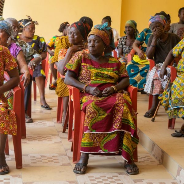Rows of widows seated together at the Abiriw community centre