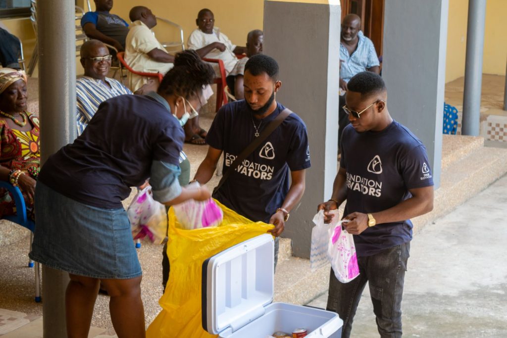 Volunteers packing individual food parcels for each family