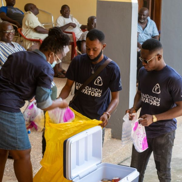 Volunteers packing individual food parcels for each family